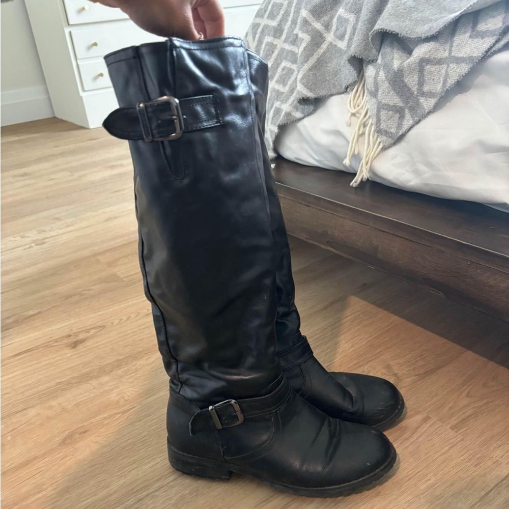 Women's black boots by TAXI